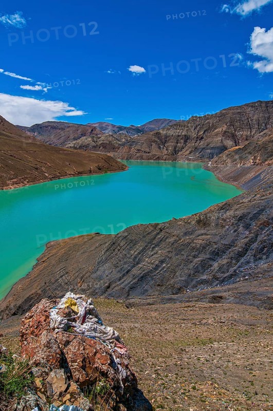 Turquoise lake on the Karo-La Pass along the Freindship Highway