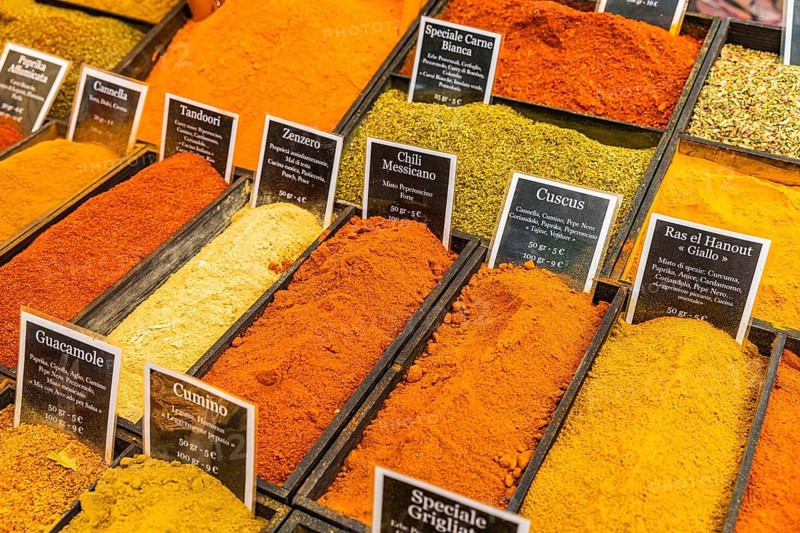 Spices in rectangular containers at the weekly market market in Portoferraio