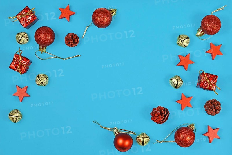Christmas flat lay with red ornaments in shape of tree baubles