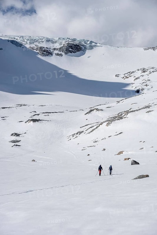 Ski tourers in winter in the mountains