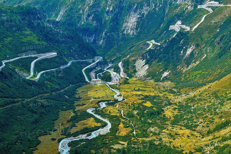 View from the Rhone glacier of the glacial stream and the pass roads