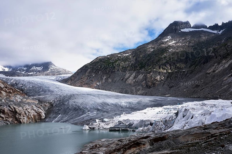 Rhone glacier partially covered with white tarpaulins to protect it from melting