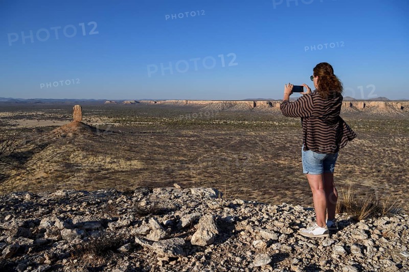 Tourist photographing the Finger Cliff