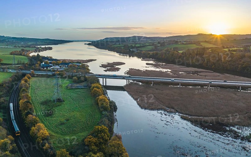Sunrise over Newton Abbot Bridge and River Teign from a drone