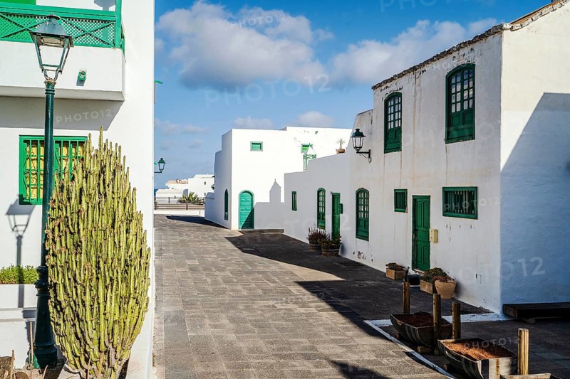Picturesque white and green settlement called Pueblo Marinero designed by Cesar Manrique located in Costa Teguise