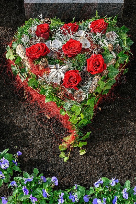 Grave with heart-shaped flower decoration