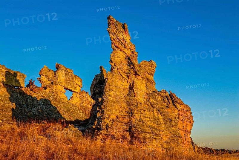Savannah and huge rock formations at sunset in the Isalo National Park