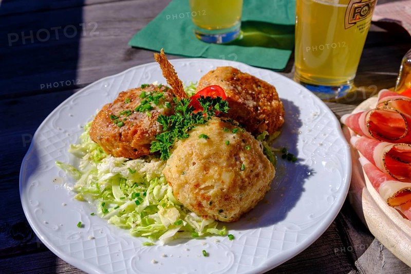 Kaspressknoedel on cabbage salad