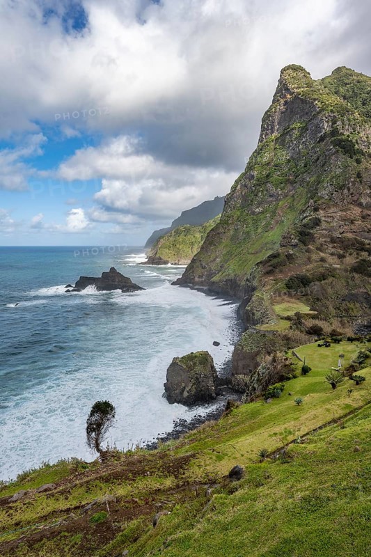 View of steep cliffs and mountains on the coast with sea