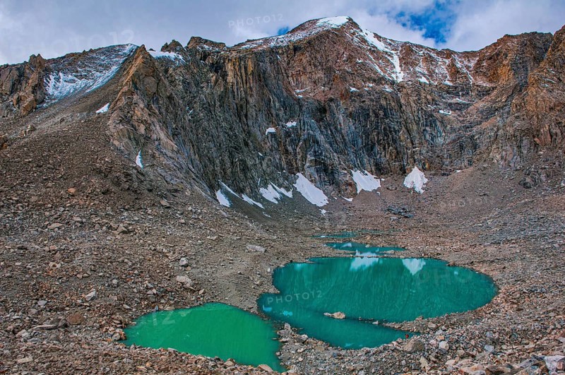Turquoise mountain lake on the Kailash Kora