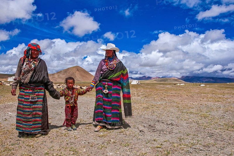 Traditional dressed women with a child