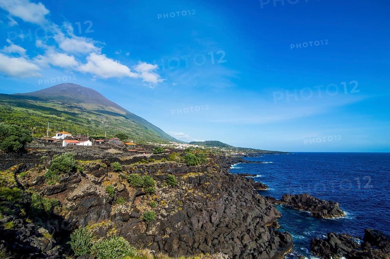Rocky coastline below Ponta do Pico highest mountain of Portugal