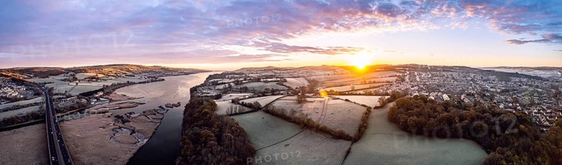 Sunrise over Bridge and Marshland of River Teign shrouded in frost from a drone