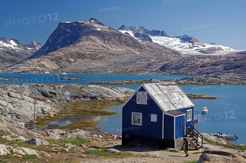 Simple cabin on a fjord