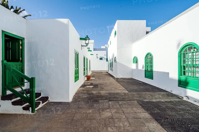 Picturesque white and green settlement called Pueblo Marinero designed by Cesar Manrique located in Costa Teguise