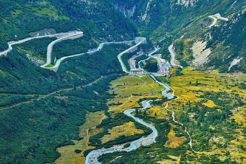 View from the Rhone glacier of the glacial stream and the pass roads