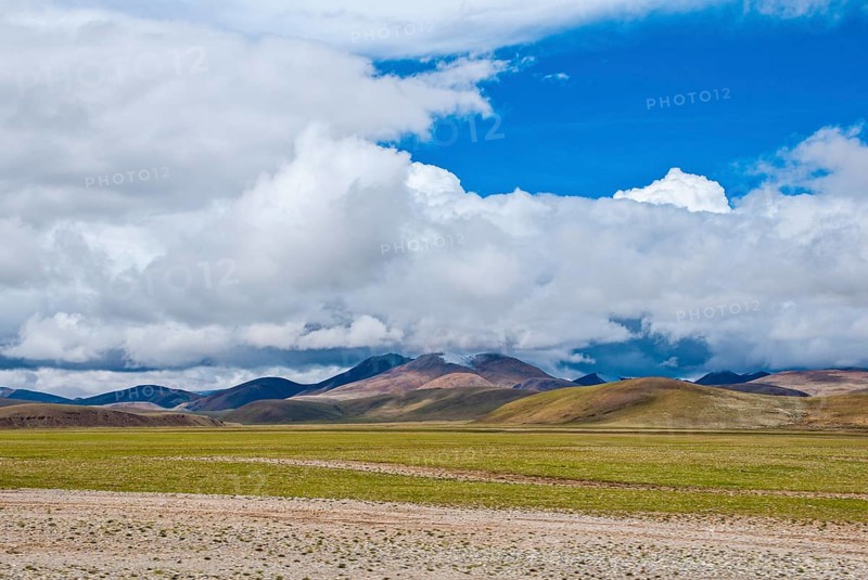 Open wide tibetan landscape along the road from Tsochen to Lhasa