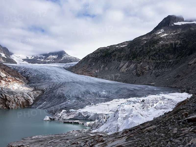 Rhone glacier partially covered with white tarpaulins to protect it from melting