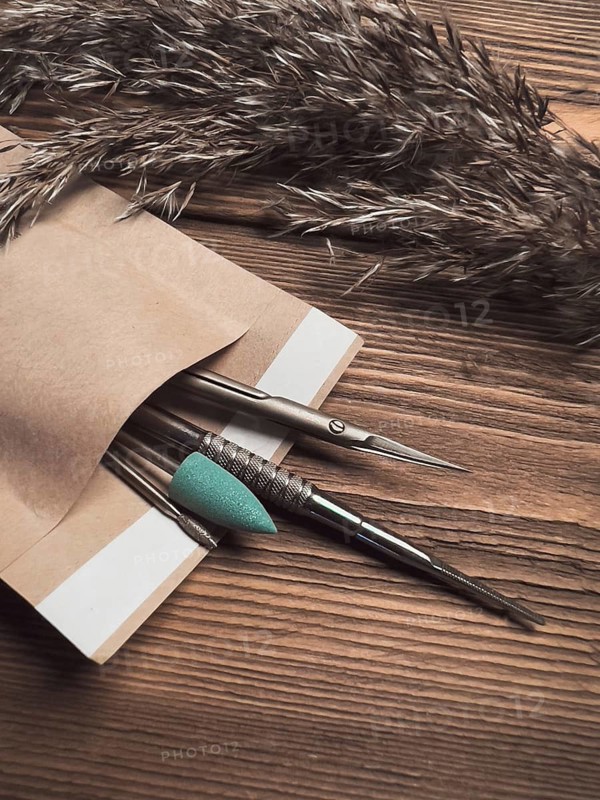 A set of sterile manicure tools in a craft package. Nail salon. Close-up
