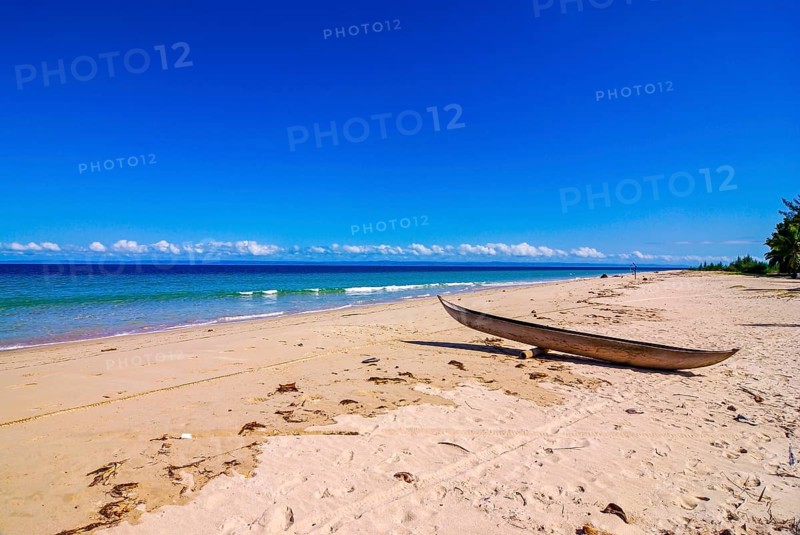 Canoe on a white sand beach on the Island Ile Sainte-Marie although Nosy Boraha