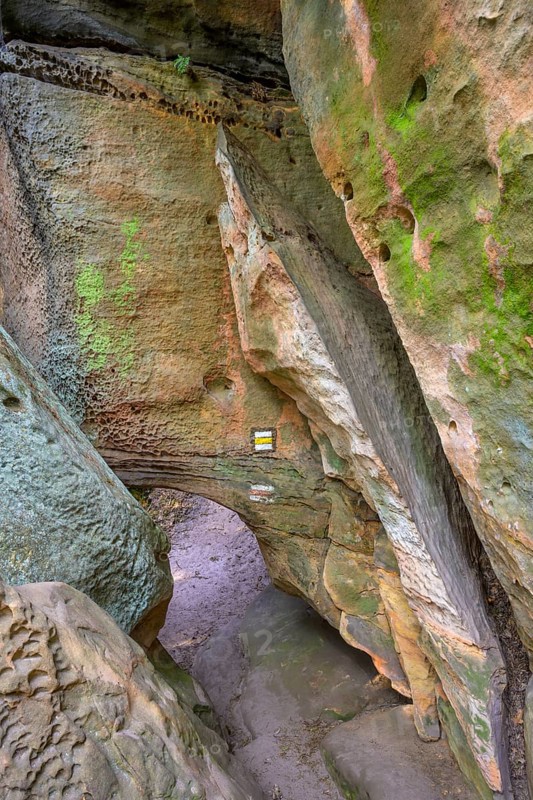 Low passage at the sandstone cliffs of