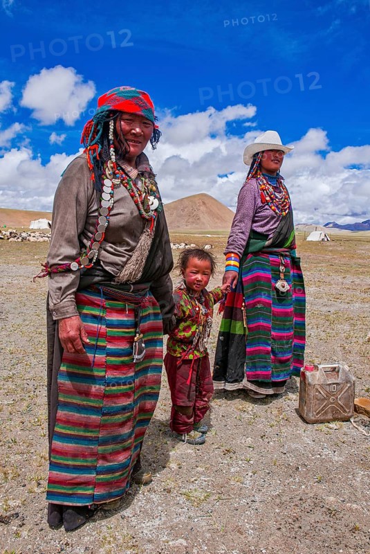 Traditional dressed women with a child