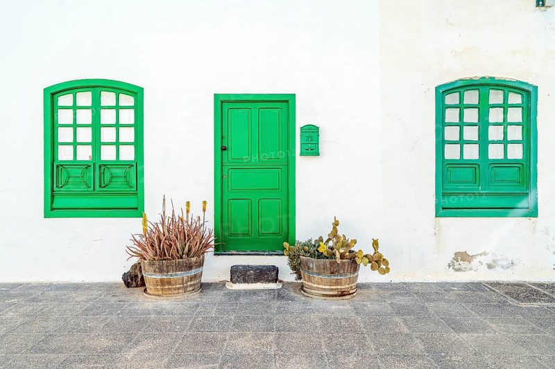 Picturesque white and green settlement called Pueblo Marinero designed by Cesar Manrique located in Costa Teguise
