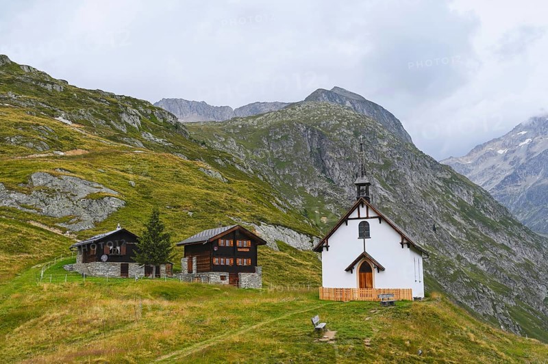 Neo-Gothic chapel on Luesgen with two wooden chalets