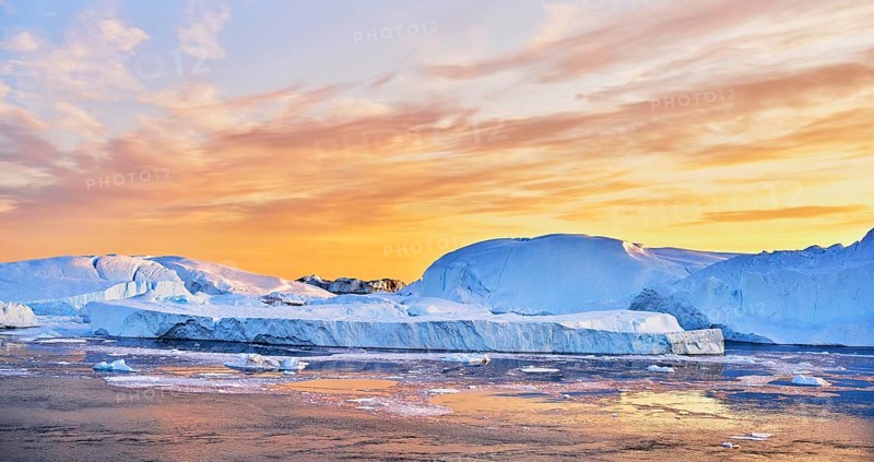 Gigantic icebergs in the evening light