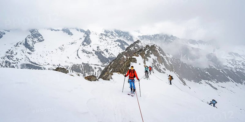 Ski tourers ascending the rope