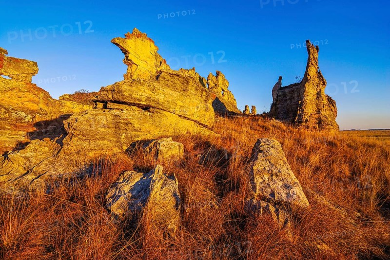 Savannah and huge rock formations at sunset in the Isalo National Park
