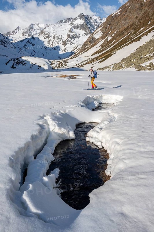 Ski tourers in winter in the mountains
