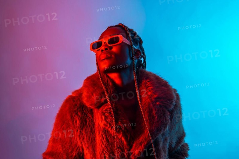 Black ethnic woman with braids with red and blue led lights