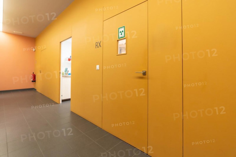 Corridor of a dental clinic with multiple boxes and the x-ray room
