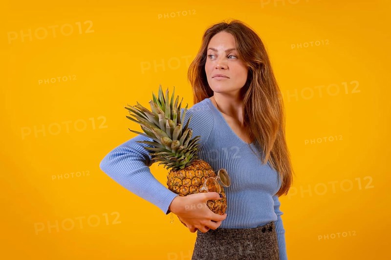 Woman with a pineapple in sunglasses