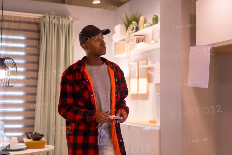 Black ethnic man shopping in a furniture store