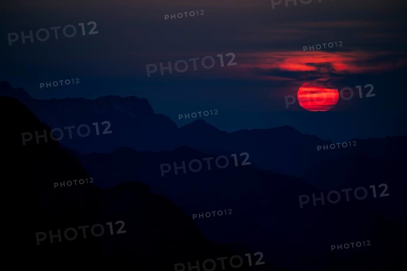 Fiery sunball at sunset with Lechtaler Alps