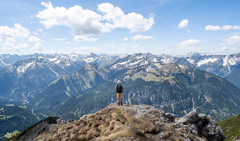 Hiker at the summit of Thaneller