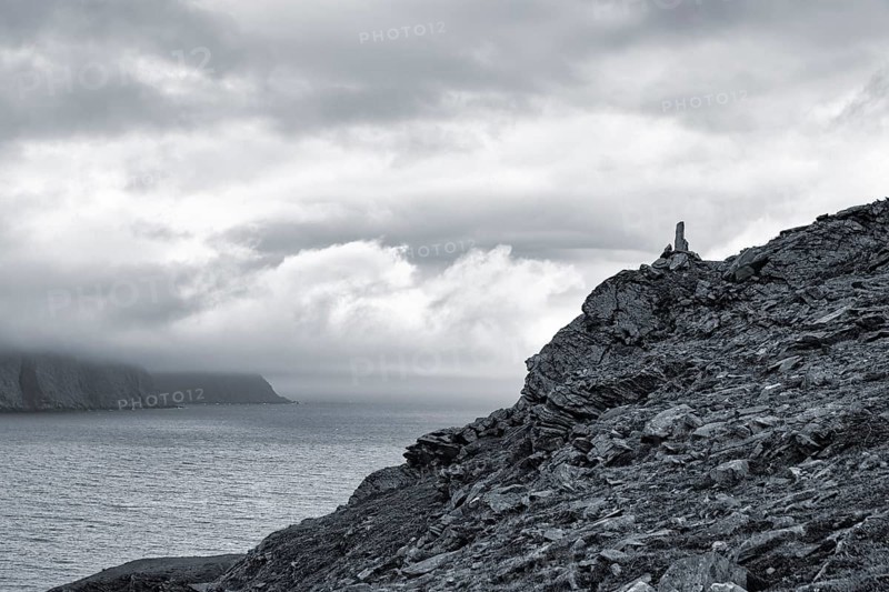 Rocky coast near Skarsvag with view to the North Cape