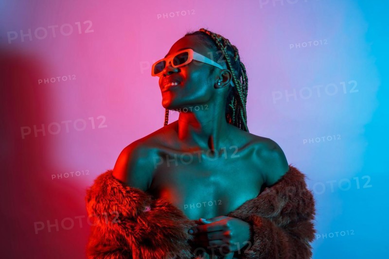 Attractive black ethnic woman with braids with red and blue led lights