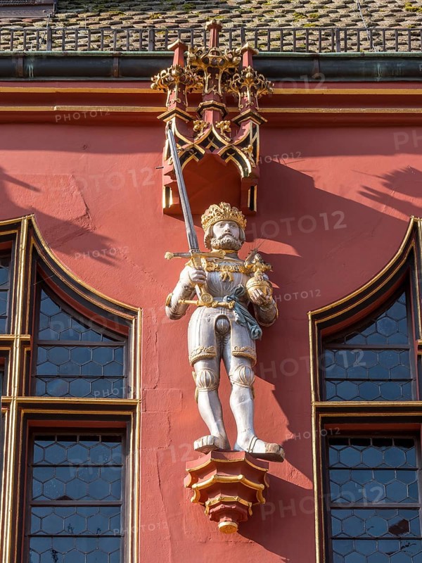 Statue on the facade of the Historic Red Department Store on Muensterplatz