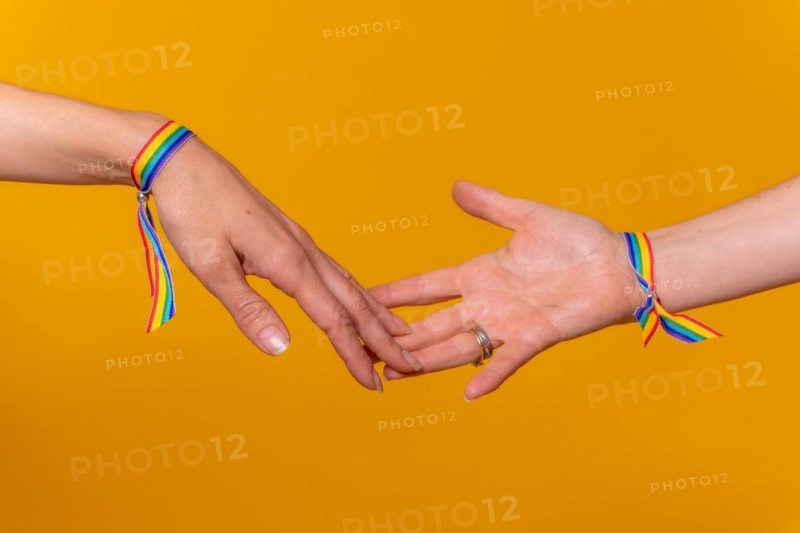 Hands of two women caressing and touching fingers