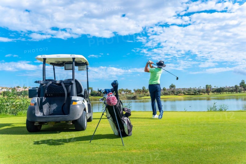Playing professional golf on golf course