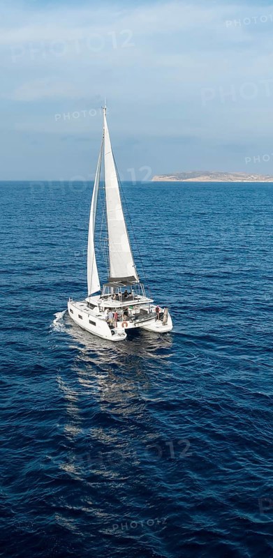 Sailing catamaran in full sail