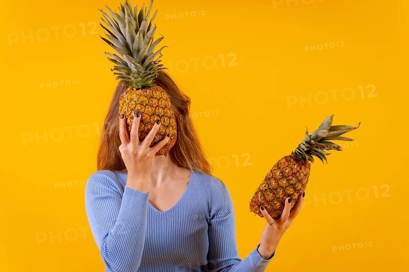 Woman with a pineapple in sunglasses