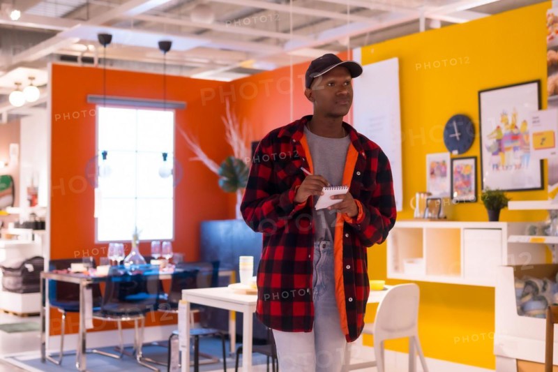 Black ethnic man shopping in a furniture store