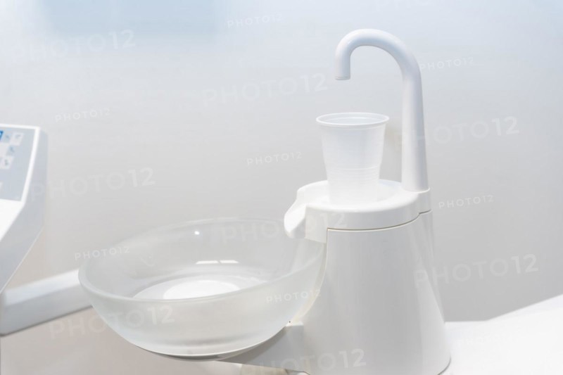 Plastic cup to rinse your mouth in the dental clinic with water