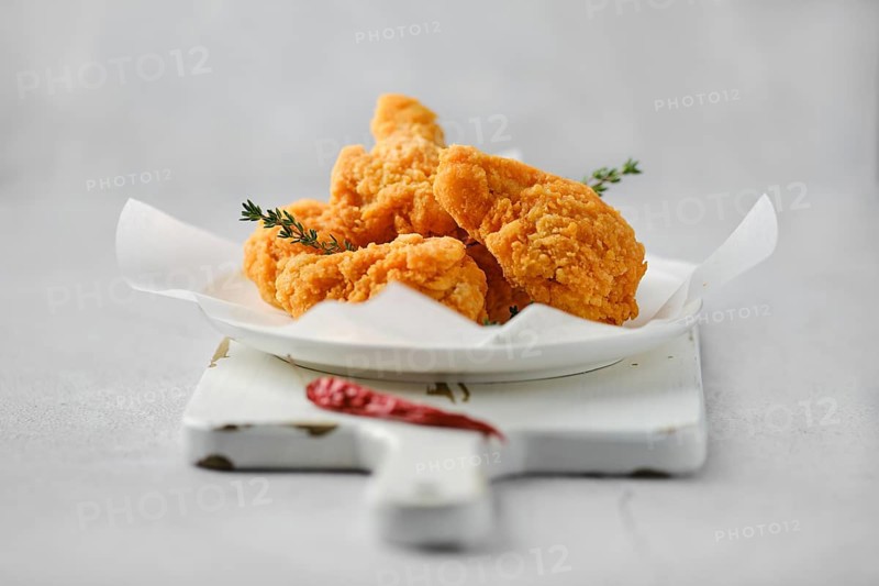 Closeup photo with shallow depth of field of deep fried spicy chicken meat