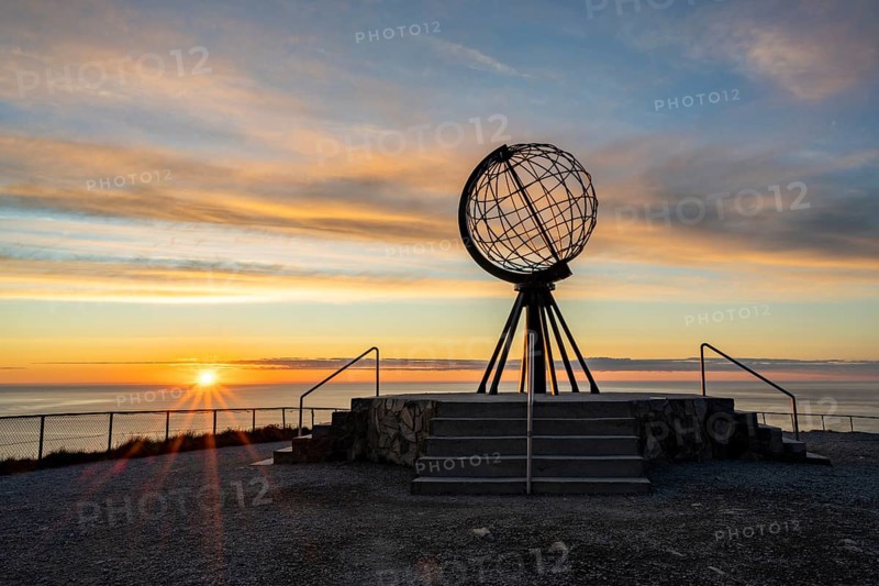 Steel globe at the North Cape under the midnight sun