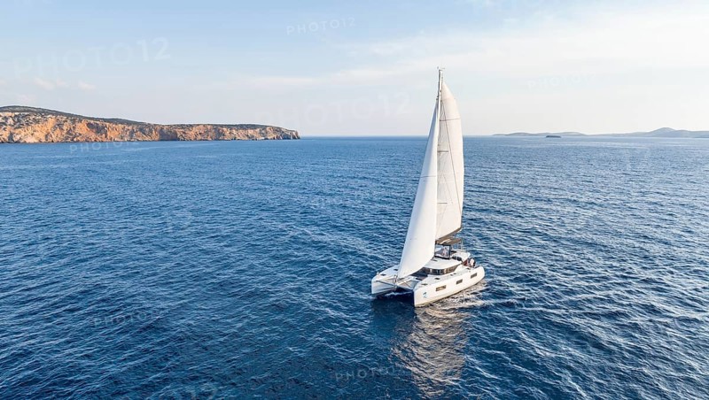 Sailing catamaran in full sail